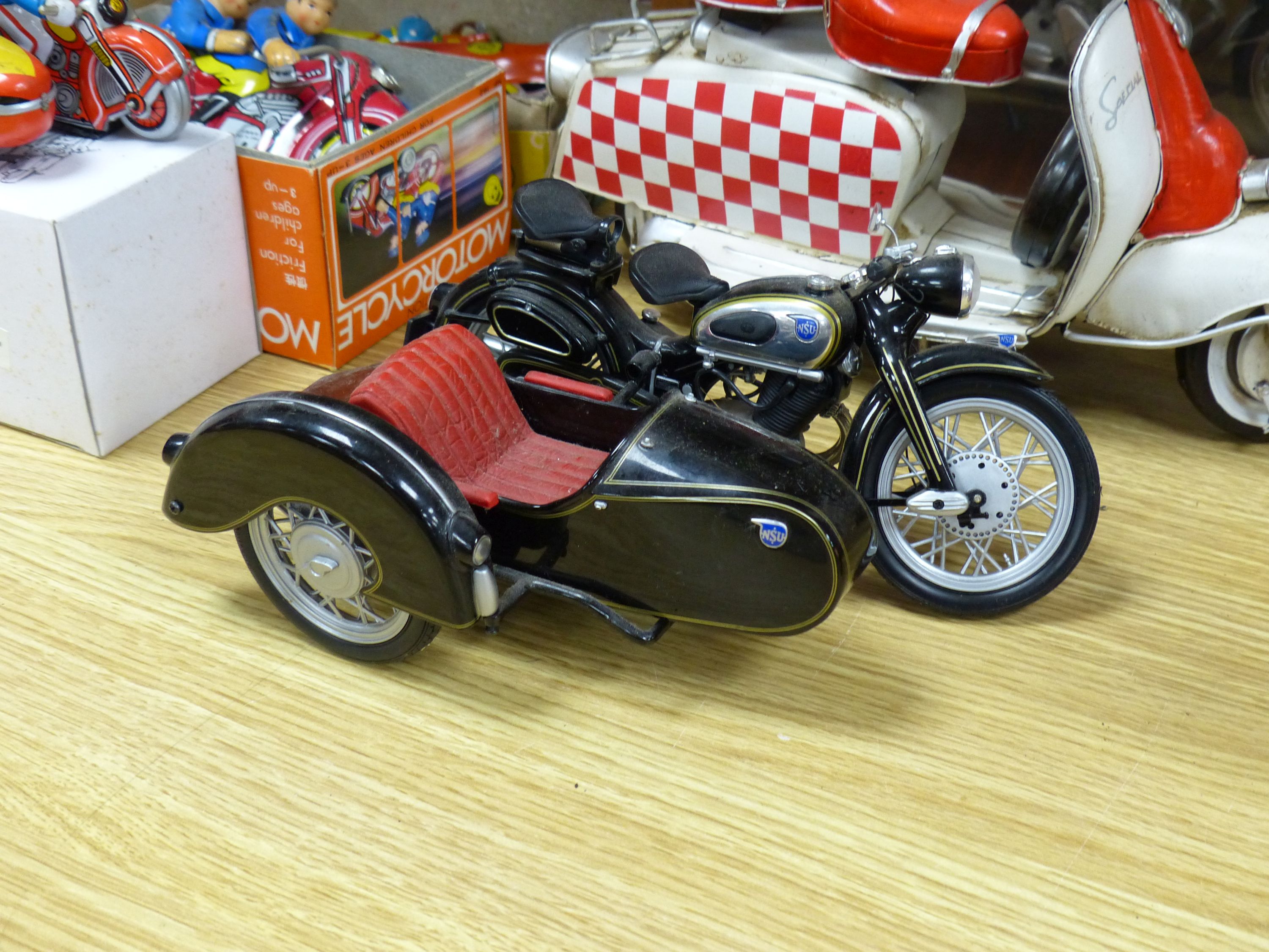 A collection of tinplate motorcycles etc